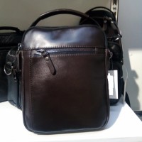 Утеряна мужская коричневая барсетка